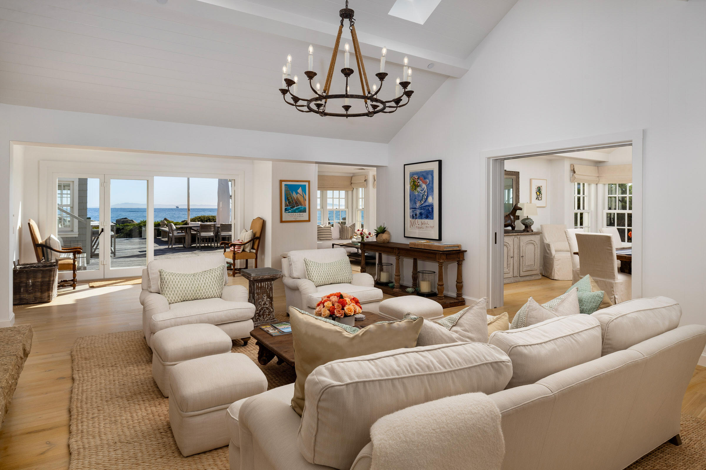 571 Sand Point Road Carpinteria, CA 93013 - Photo 5 of 49 a living room with furniture a chandelier and kitchen view
