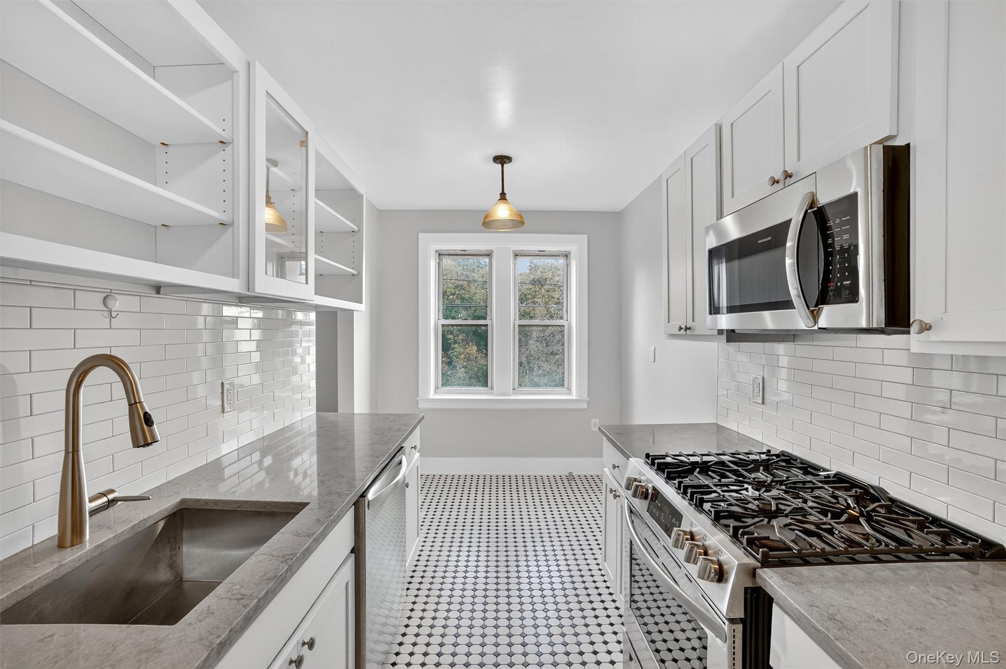 294 Bronxville Road, Unit 4C Bronxville, NY 10708 - Photo 13 of 26 a kitchen with granite countertop a stove and a sink