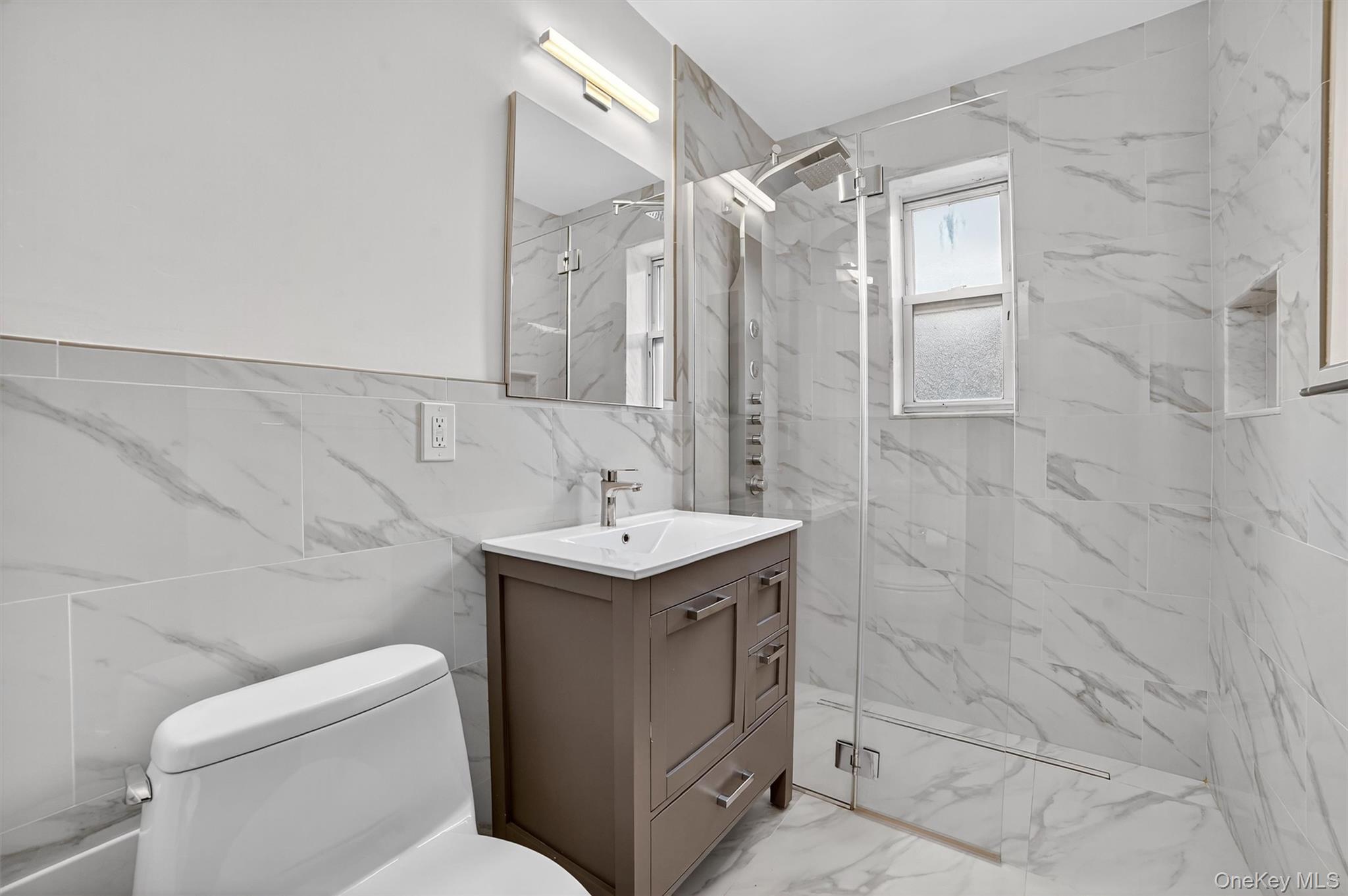 294 Bronxville Road, Unit 4C Bronxville, NY 10708 - Photo 18 of 26 a bathroom with a sink toilet and shower