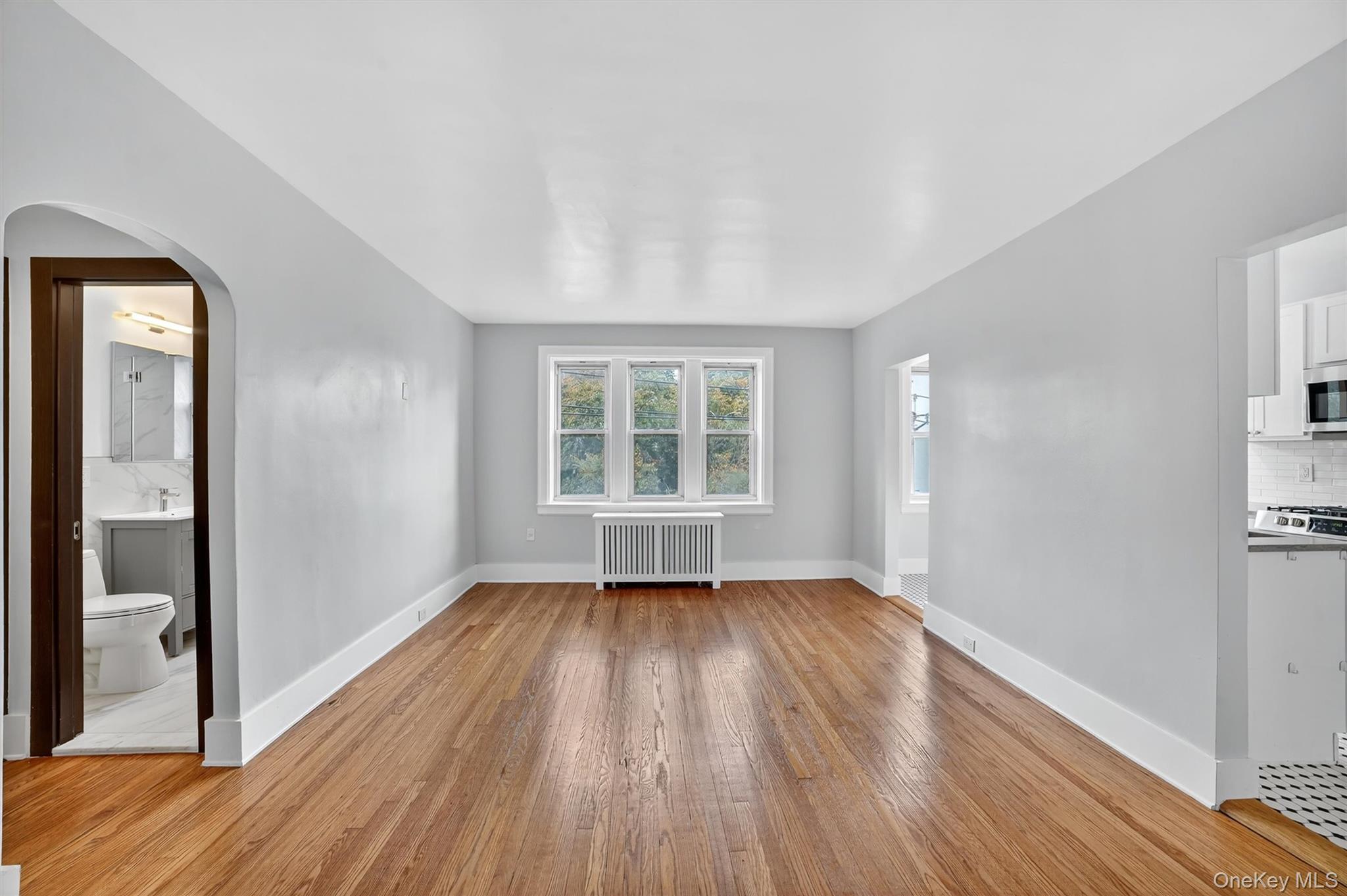 294 Bronxville Road, Unit 4C Bronxville, NY 10708 - Photo 22 of 26 a view of empty room with wooden floor and fan