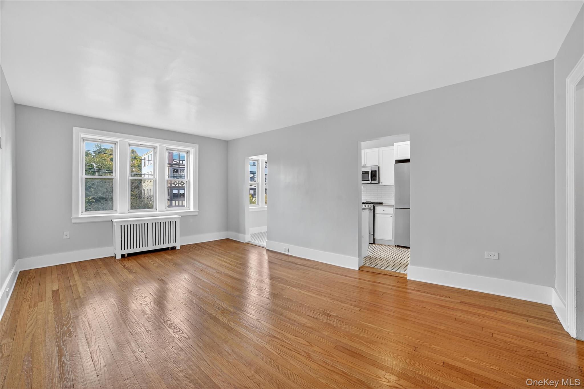 294 Bronxville Road, Unit 4C Bronxville, NY 10708 - Photo 24 of 26 a view of empty room with wooden floor and window