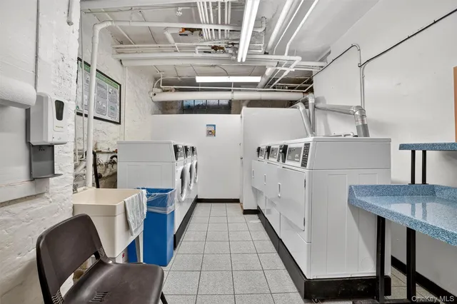 a view of a kitchen with furniture and wooden floor