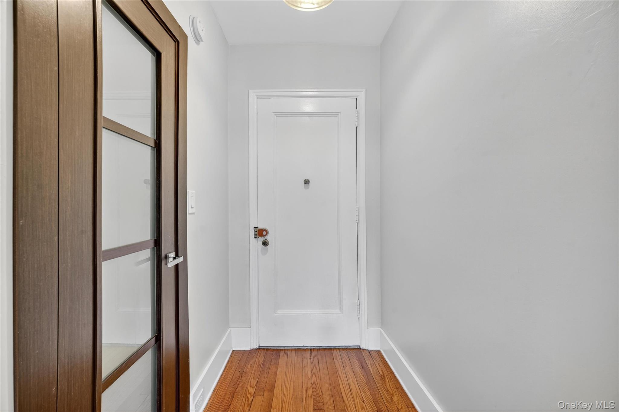 294 Bronxville Road, Unit 4C Bronxville, NY 10708 - Photo 6 of 26 a view of a hallway with wooden floor