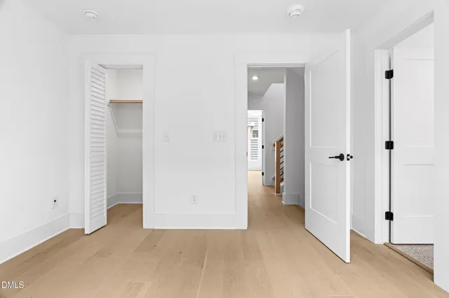 wooden floor and closet in a en suite bathroom