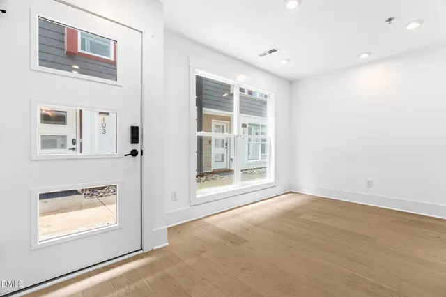 a view of an empty room with a window