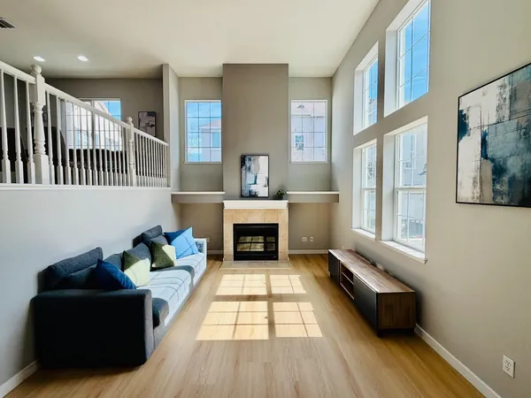 a living room with furniture and a fireplace