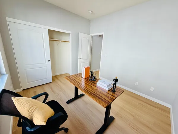 a workspace with furniture and wooden floor