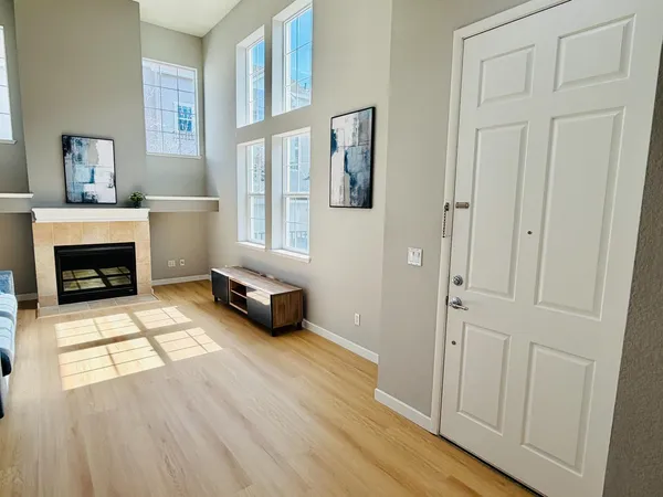a living room with furniture and a fireplace