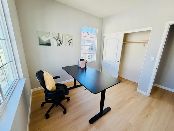 a view of a dining room with furniture and wooden floor