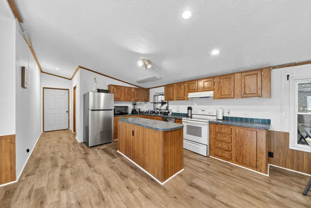 a bathroom with a sink toilet and a mirror