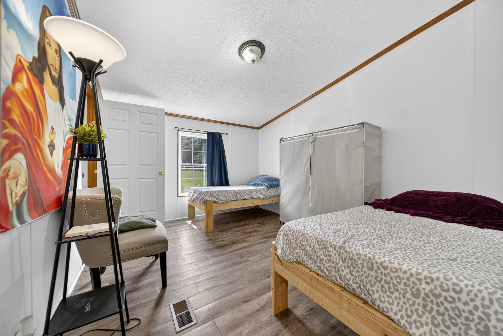 2600 Round Hill Road Lewisburg, TN 37091 - Photo 30 of 100 a bedroom with a bed and a chandelier