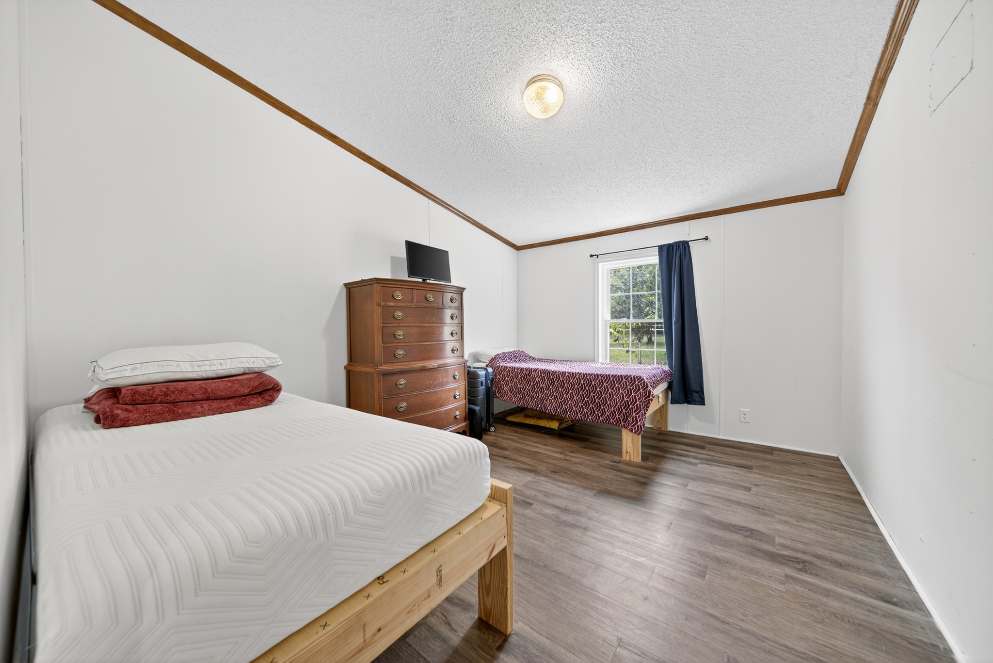 2600 Round Hill Road Lewisburg, TN 37091 - Photo 36 of 100 a bedroom with a bed and wooden floor