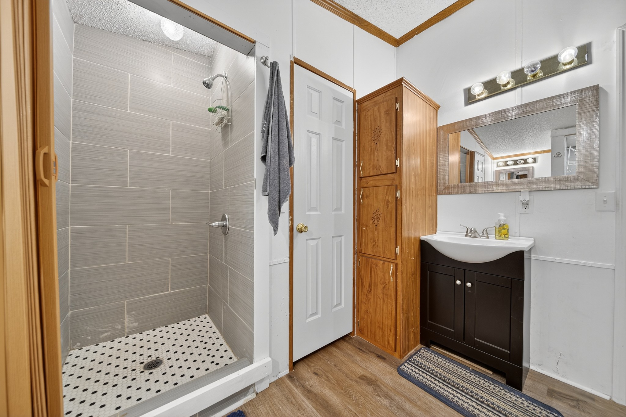 2600 Round Hill Road Lewisburg, TN 37091 - Photo 43 of 100 a bathroom with a sink a toilet a mirror and shower