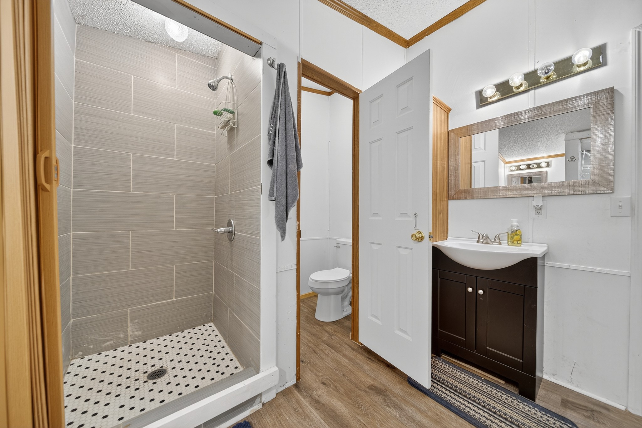 2600 Round Hill Road Lewisburg, TN 37091 - Photo 44 of 100 a bathroom with a sink a toilet a mirror and shower