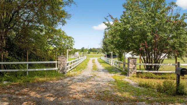 a view of a house with backyard