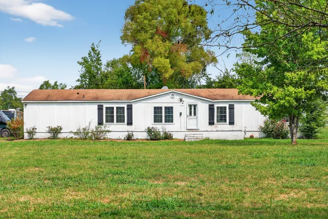 a kitchen with stainless steel appliances granite countertop a refrigerator stove microwave and sink