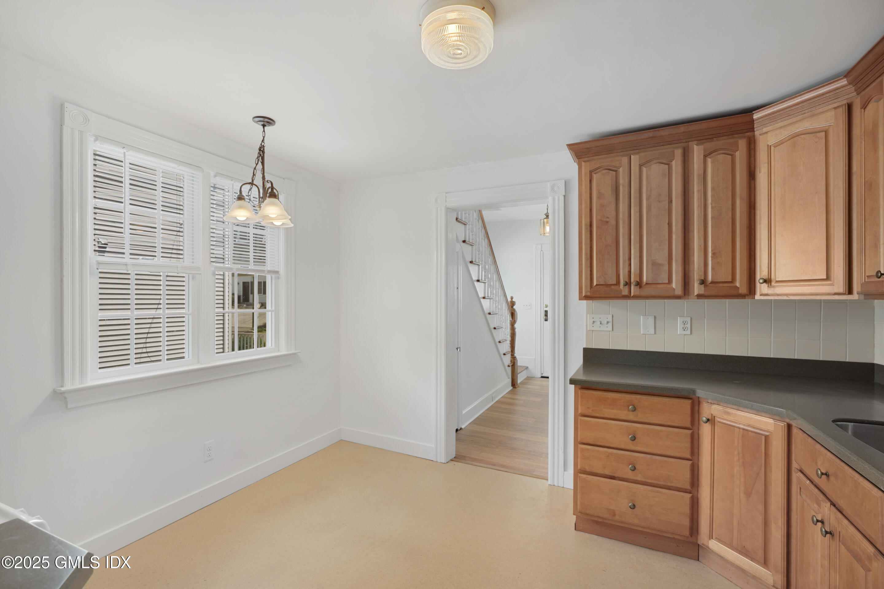 52 Locust Street Greenwich, CT 06830 - Photo 12 of 35 an empty room with windows