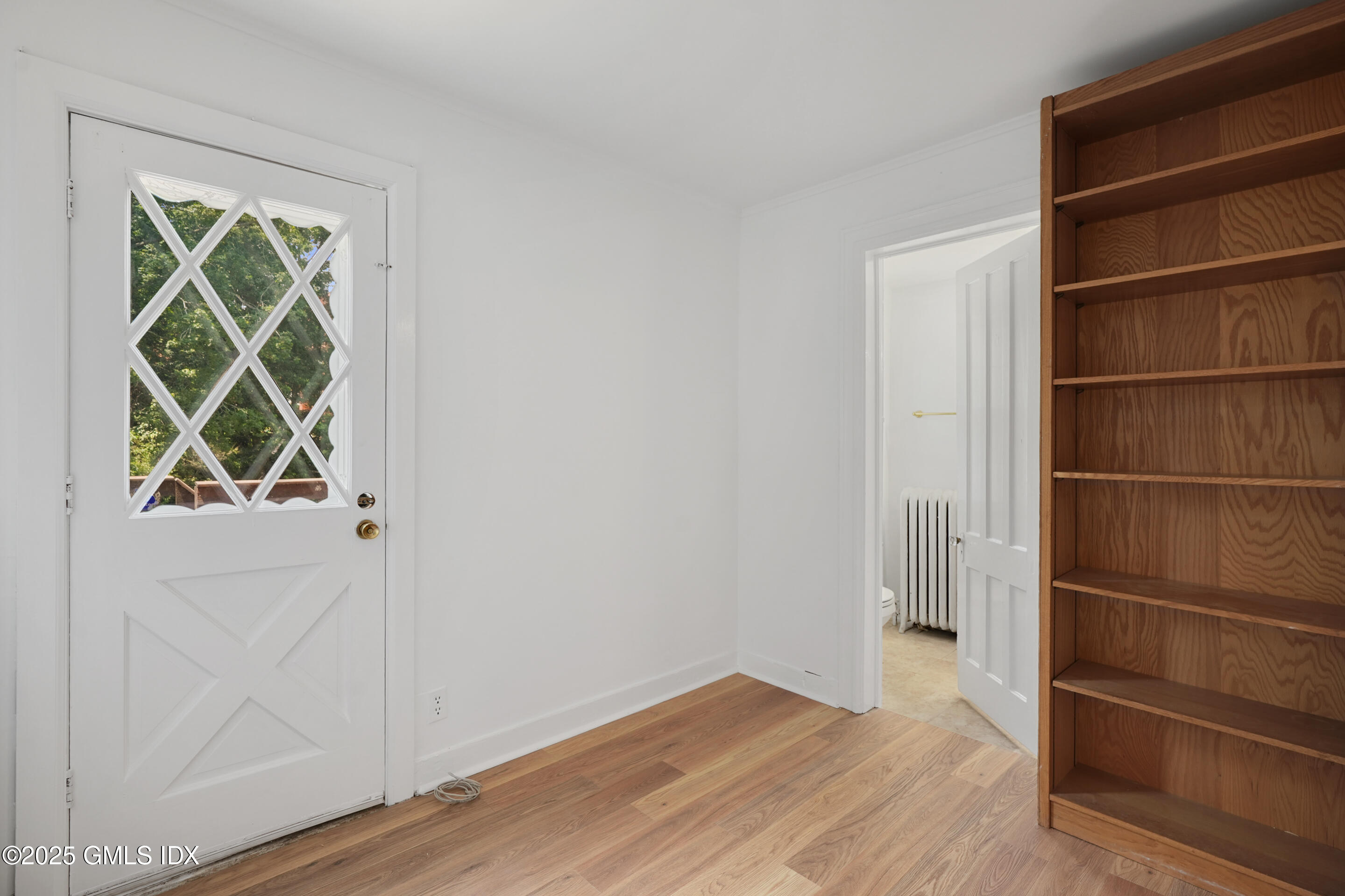 52 Locust Street Greenwich, CT 06830 - Photo 13 of 35 a view of walk in closet with empty racks