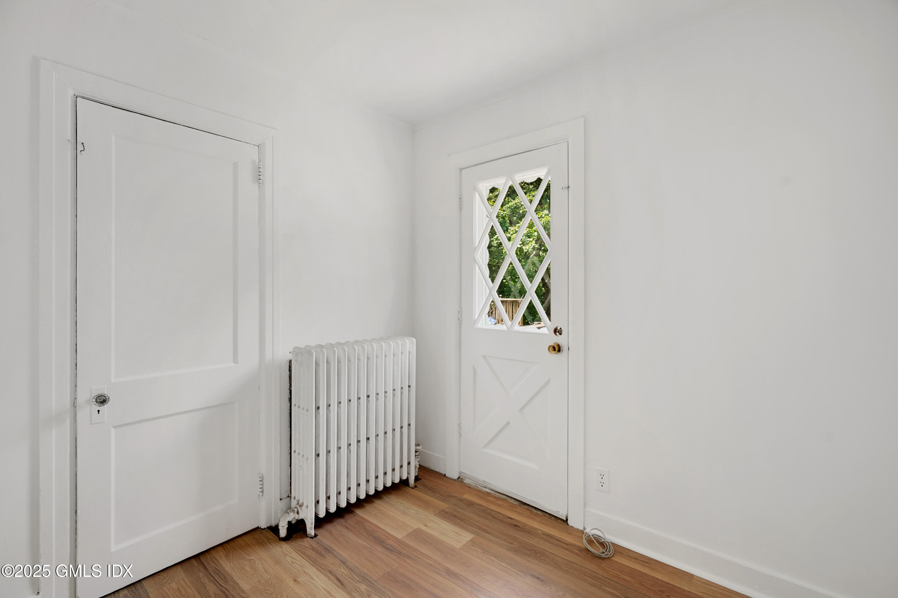 52 Locust Street Greenwich, CT 06830 - Photo 15 of 35 a view of an entryway with wooden floor