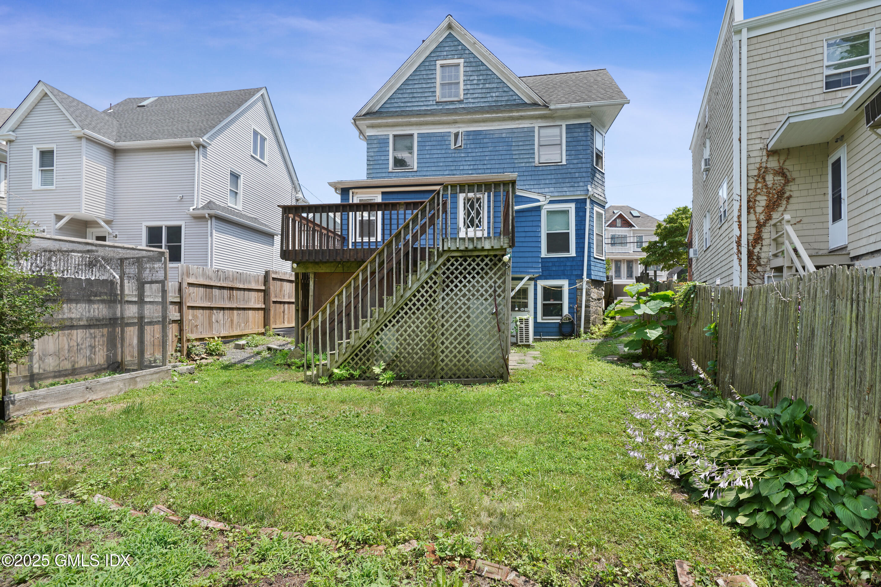52 Locust Street Greenwich, CT 06830 - Photo 26 of 35 a front view of a house with a yard