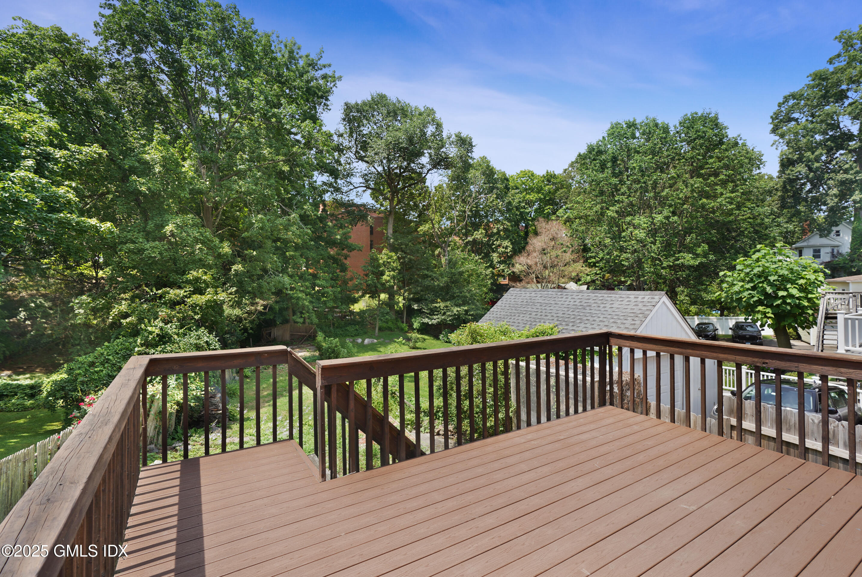 52 Locust Street Greenwich, CT 06830 - Photo 28 of 35 a view of balcony with wooden floor and fence