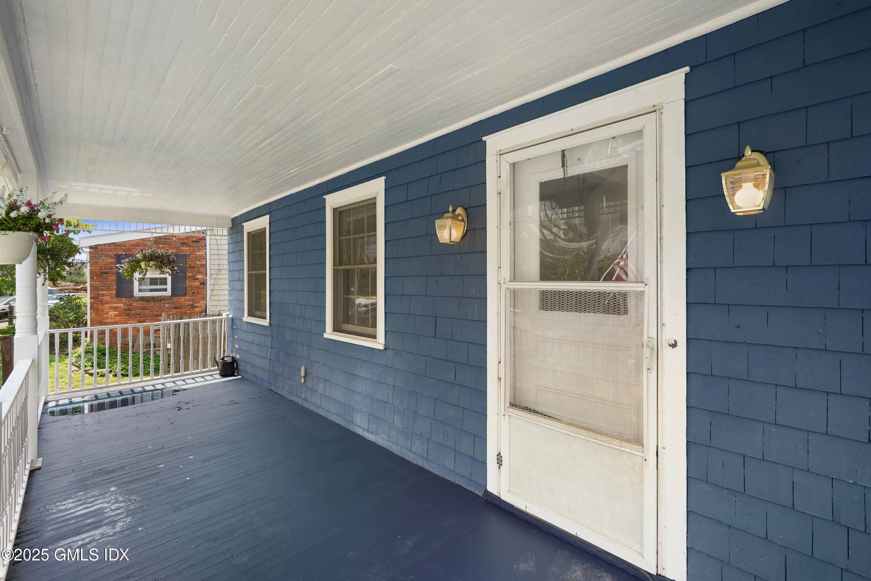52 Locust Street Greenwich, CT 06830 - Photo 3 of 35 wooden floor in a hall with an entryway