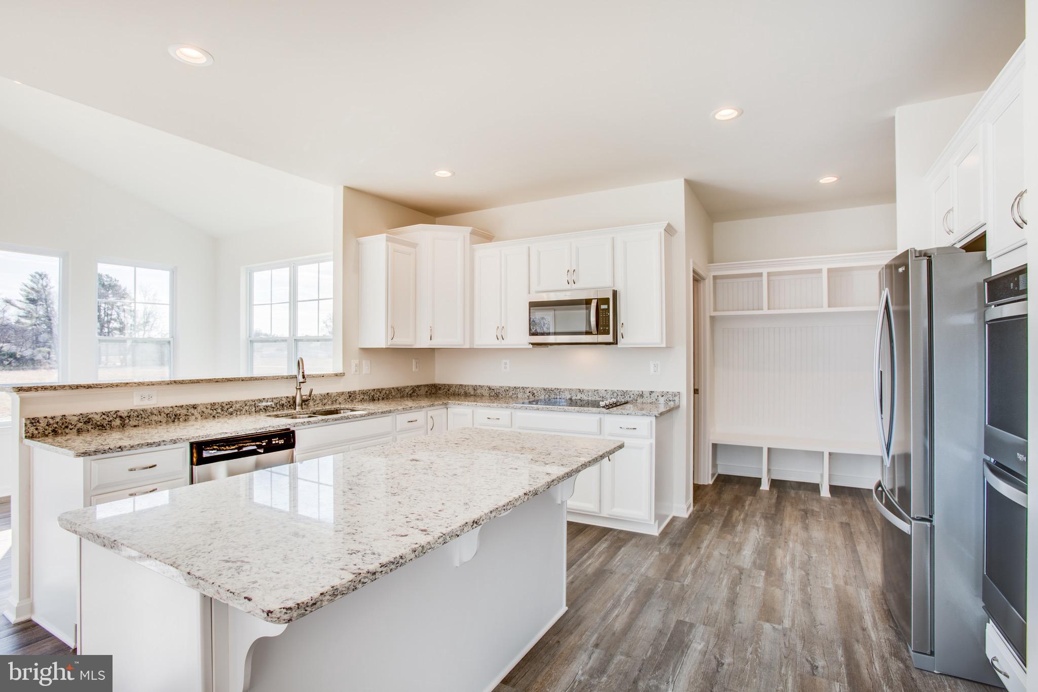 4 Caledon Road King George, VA 22485 - Photo 4 of 8 a kitchen with stainless steel appliances granite countertop a sink stove and refrigerator