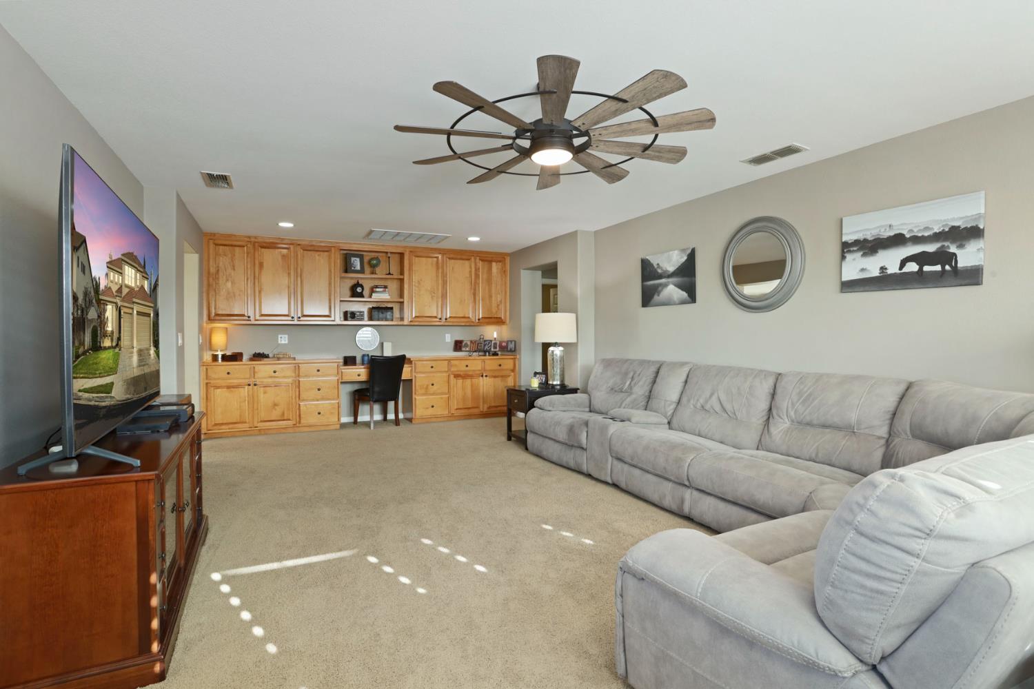 565 Bodeson Court Ripon, CA 95366 - Photo 35 of 65 a living room with furniture and kitchen view