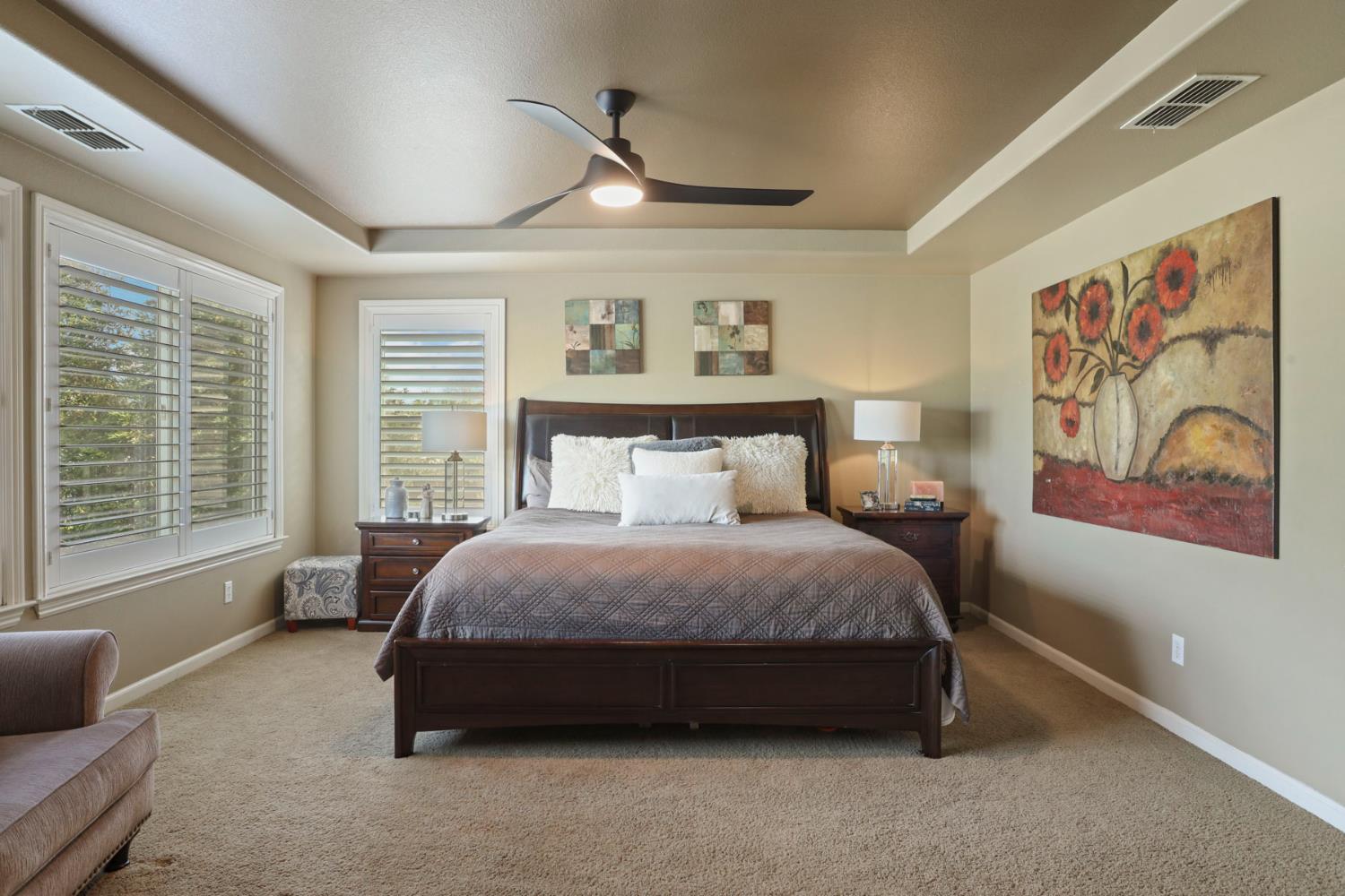 565 Bodeson Court Ripon, CA 95366 - Photo 39 of 65 a spacious bedroom with a bed and glass window