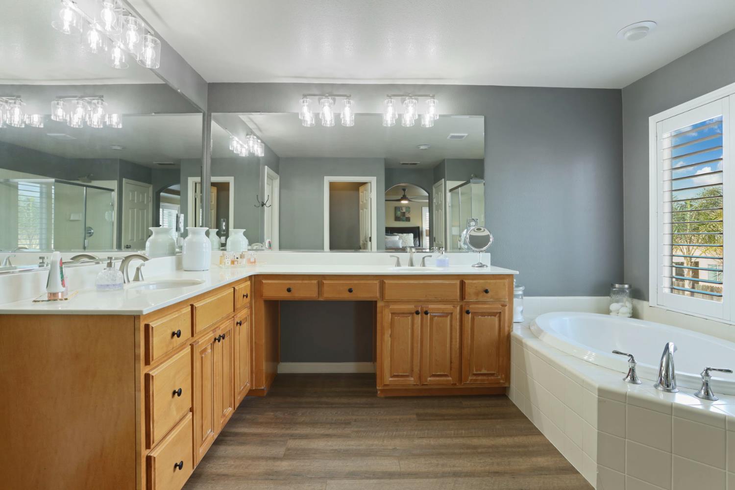 565 Bodeson Court Ripon, CA 95366 - Photo 42 of 65 a spacious bathroom with a large tub shower and sink