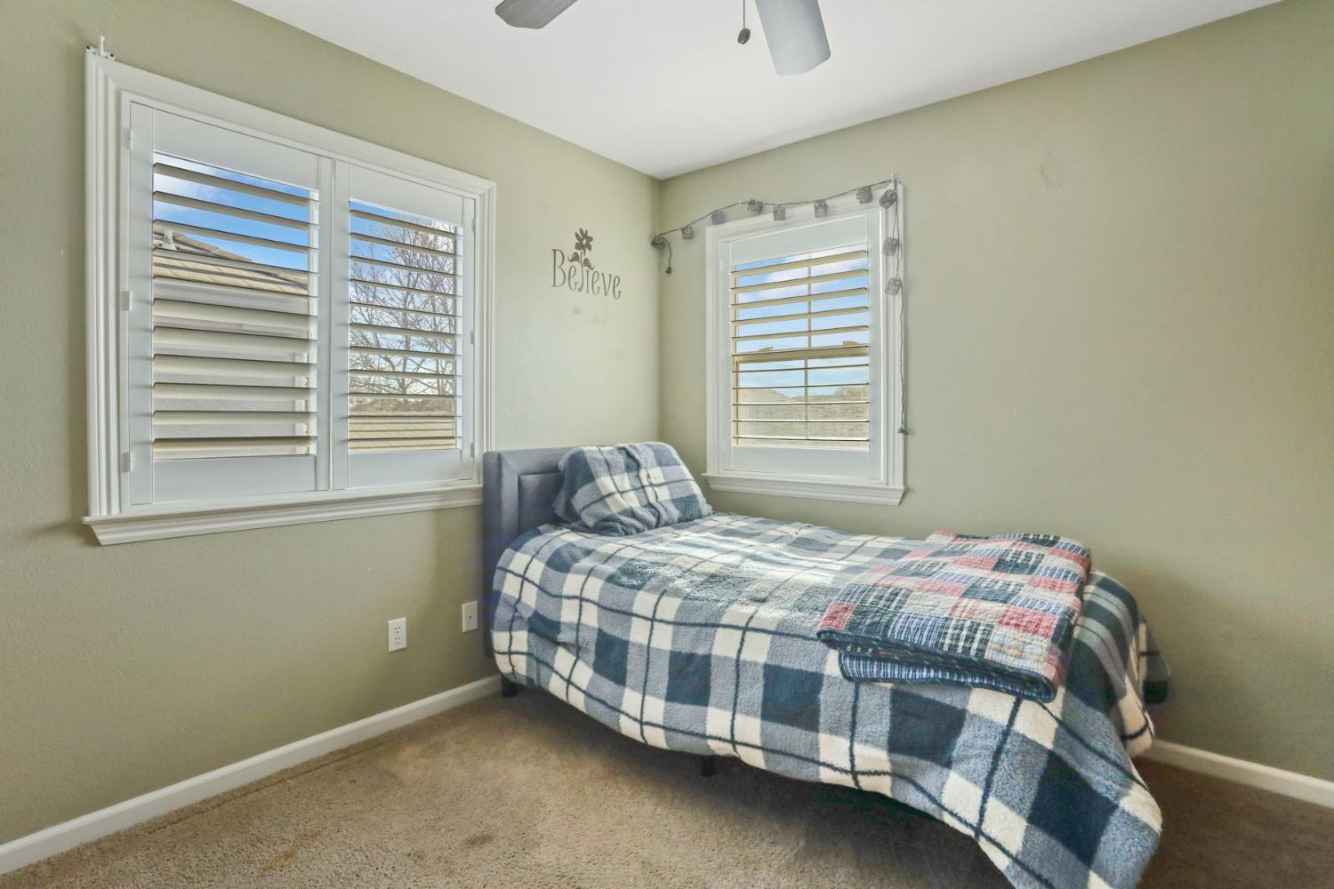 565 Bodeson Court Ripon, CA 95366 - Photo 48 of 65 a bedroom with a bed next to a window