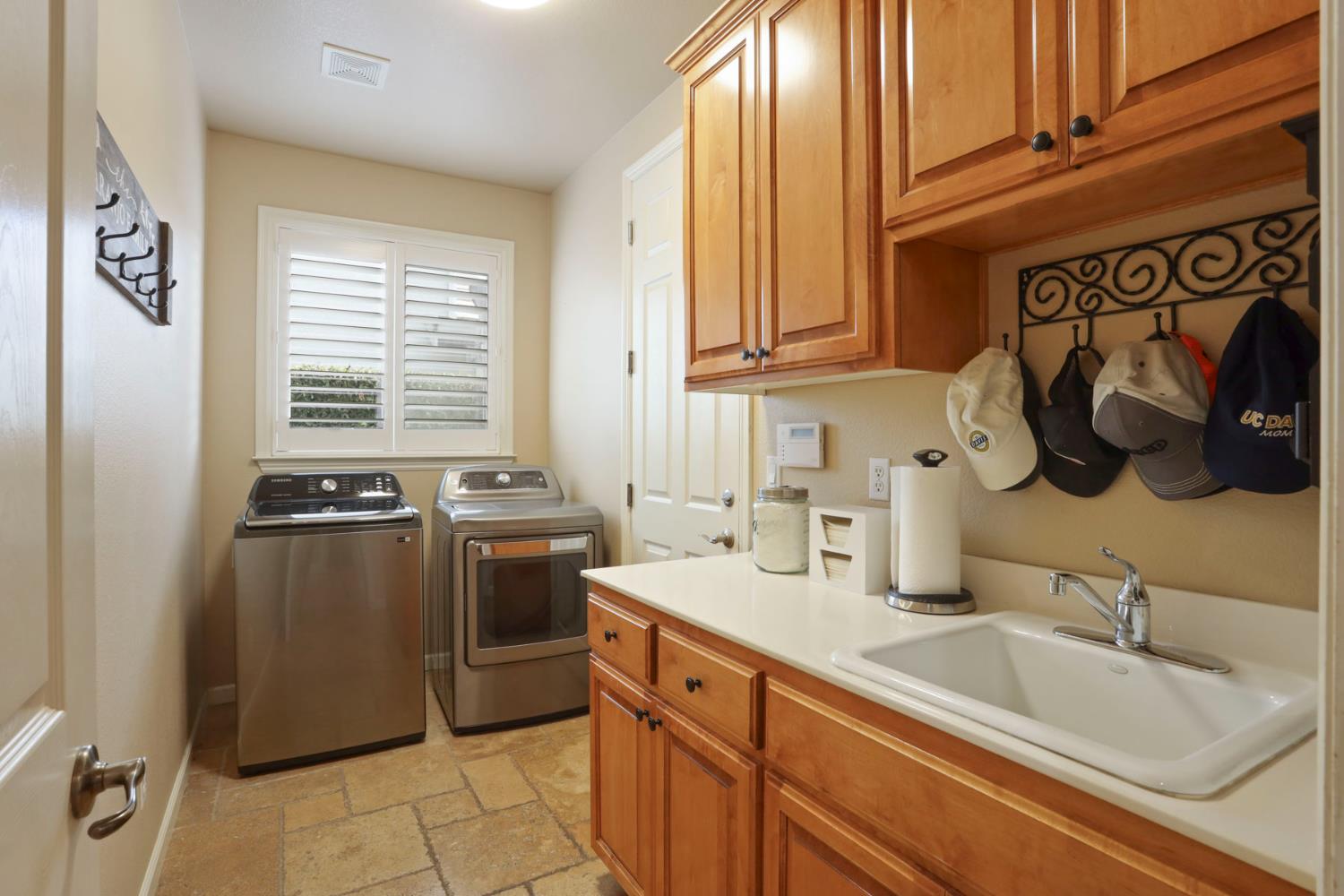 565 Bodeson Court Ripon, CA 95366 - Photo 52 of 65 a kitchen with stainless steel appliances granite countertop a sink and cabinets
