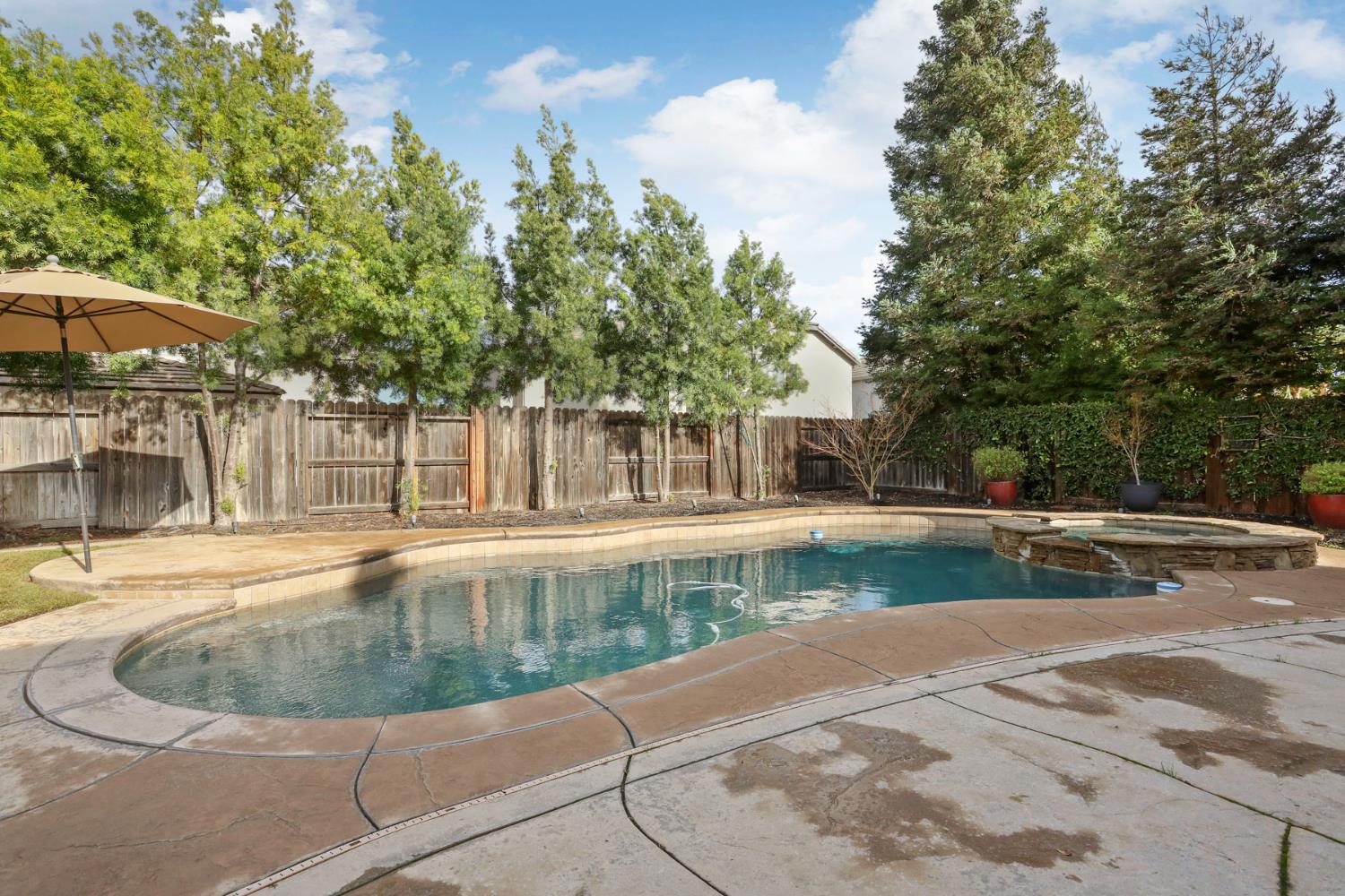 565 Bodeson Court Ripon, CA 95366 - Photo 57 of 65 a view of a swimming pool with a patio