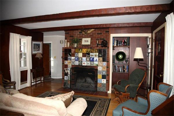 625 Boston Post Road Sudbury, MA 01776 - Photo 8 of 14 a living room with furniture a fireplace and decor