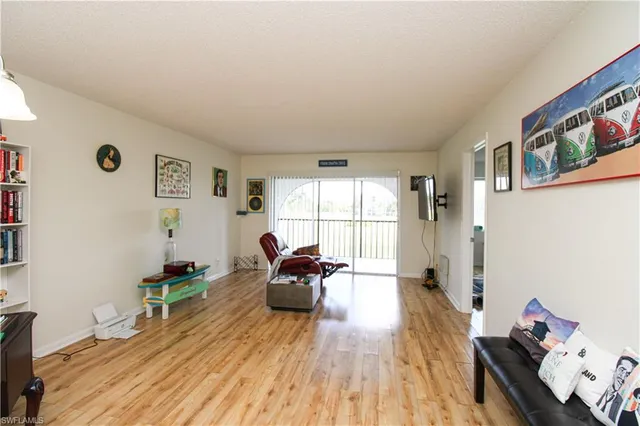a room with furniture wooden floor and window