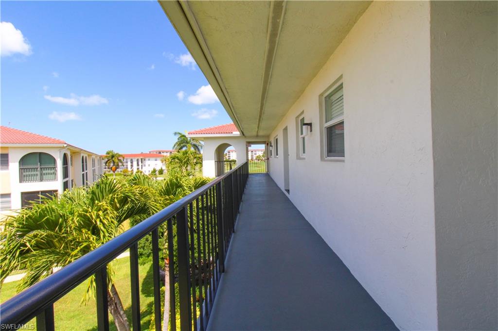 41 High Point Circle South, Unit 303 Naples, FL 34103 - Photo 27 of 39 a view of balcony and yard