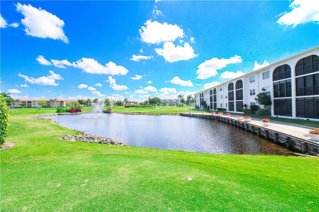 41 High Point Circle South, Unit 303 Naples, FL 34103 - Photo 3 of 39 a view of a lake