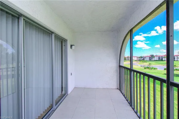 a view of a porch and a yard