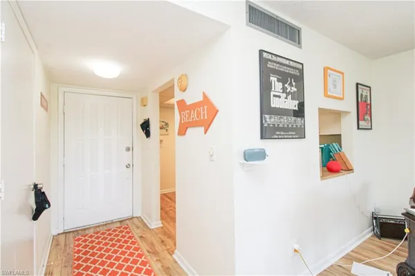 a kitchen with a sink cabinets and white appliances