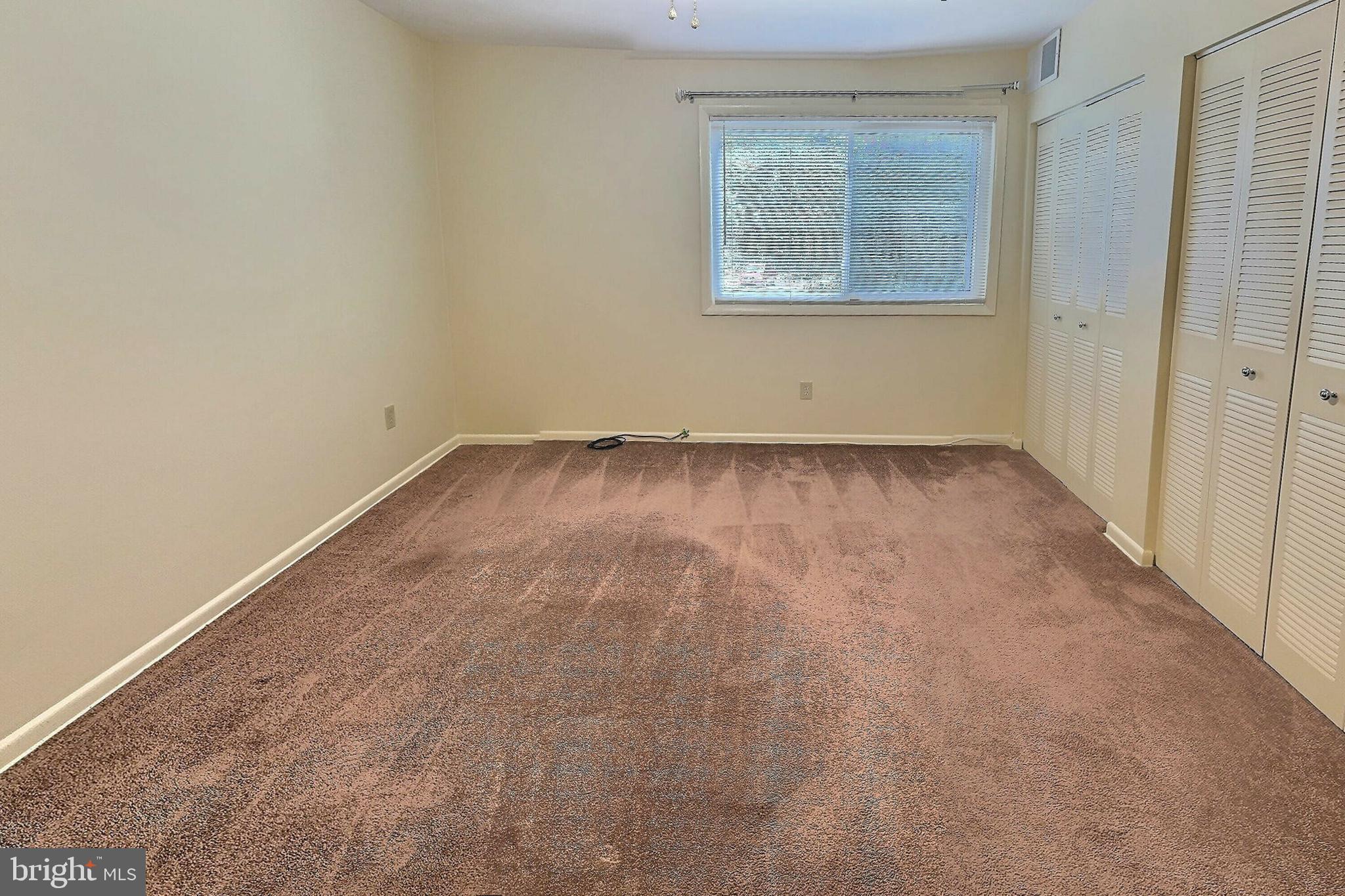 3136 Brinkley Road, Unit 204 Temple Hills, MD 20748 - Photo 11 of 19 an empty room with a window