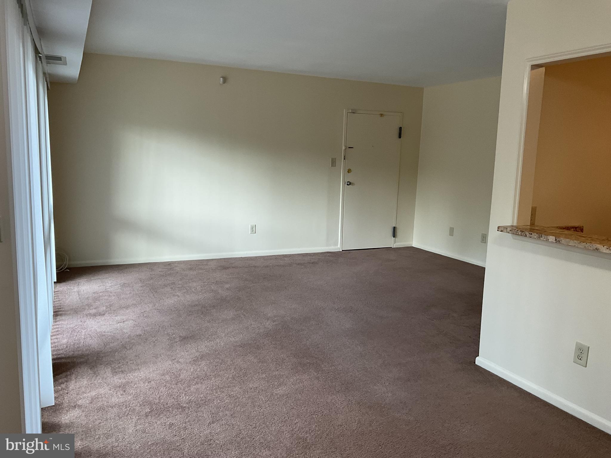 3136 Brinkley Road, Unit 204 Temple Hills, MD 20748 - Photo 12 of 19 an empty room with an entryway