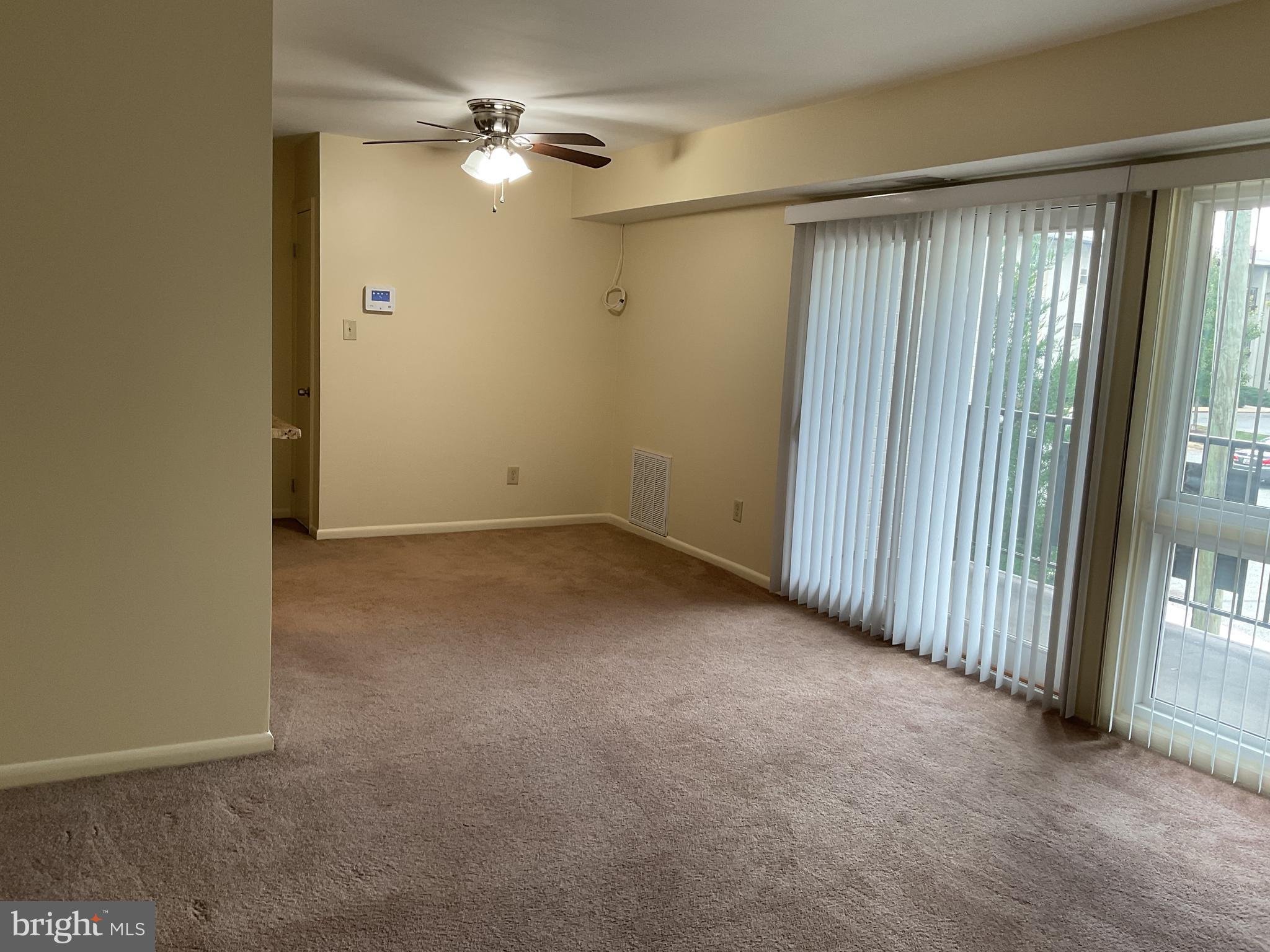 3136 Brinkley Road, Unit 204 Temple Hills, MD 20748 - Photo 14 of 19 an empty room with windows and fan