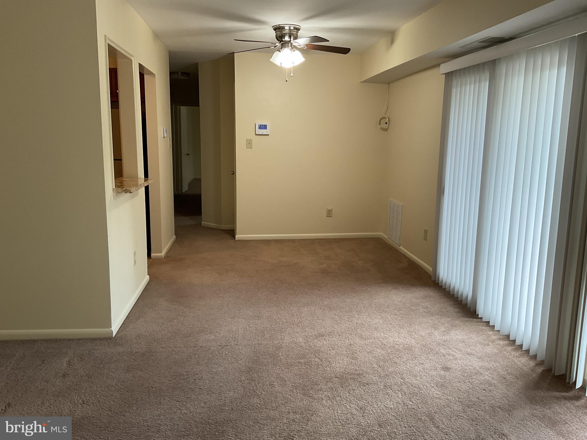 3136 Brinkley Road, Unit 204 Temple Hills, MD 20748 - Photo 15 of 19 an empty room with closet and a chandelier fan