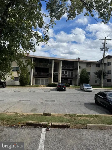 a view of a car park in front of house
