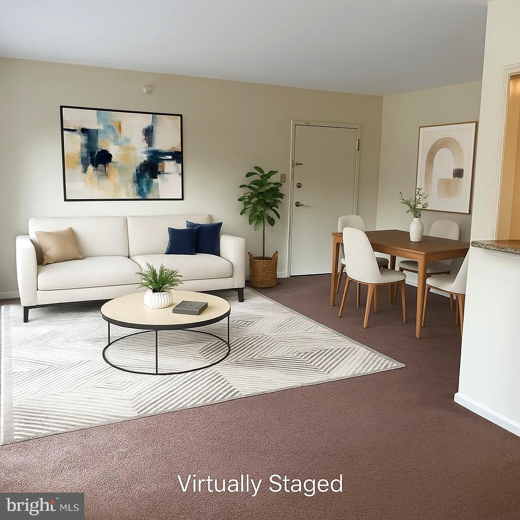 3136 Brinkley Road, Unit 204 Temple Hills, MD 20748 - Photo 4 of 19 a living room with furniture and a potted plant