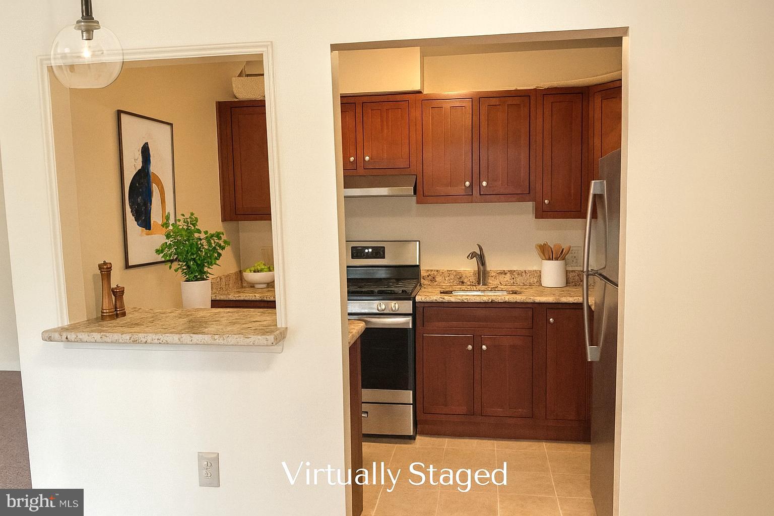 3136 Brinkley Road, Unit 204 Temple Hills, MD 20748 - Photo 6 of 19 a kitchen with stainless steel appliances granite countertop a sink and a refrigerator