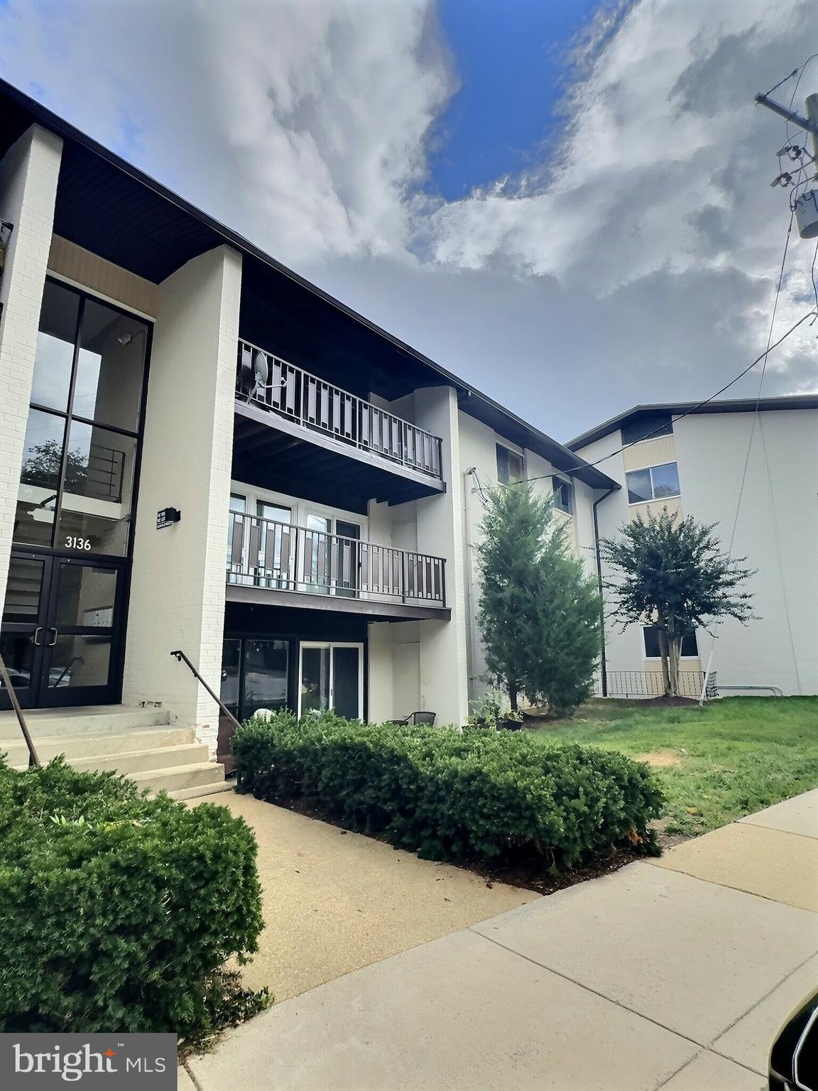 3136 Brinkley Road, Unit 204 Temple Hills, MD 20748 - Photo 10 of 19 a view of a building with a garden