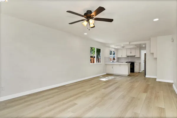 a kitchen with a sink appliances and cabinets