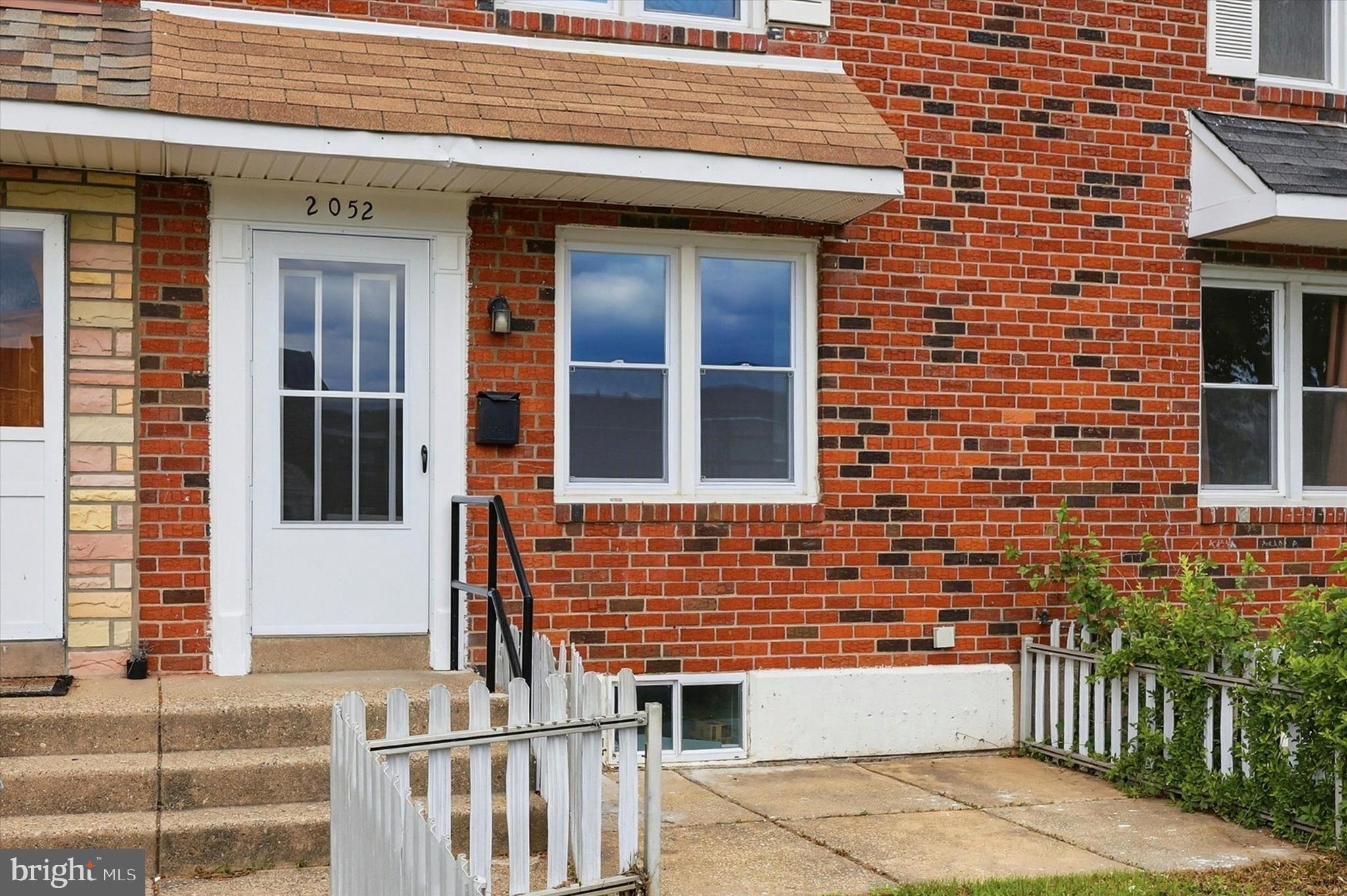 2052 Heather Road Folcroft, PA 19032 - Photo 2 of 17 front view of a brick house with a window