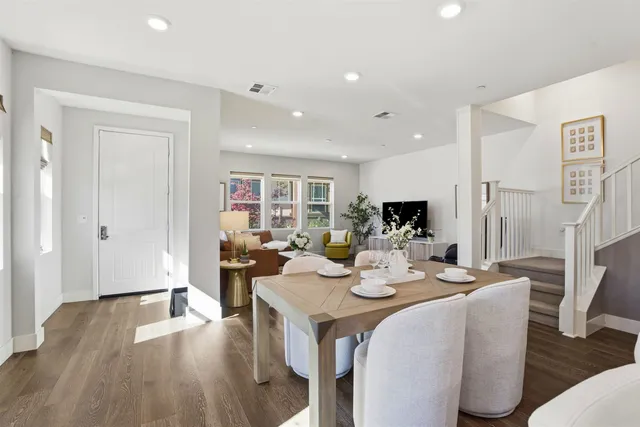 a view of a dining room with furniture window and wooden floor